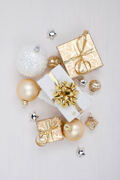 Christmas composition. Christmas gift boxes with Christmas balls on white background - 写真・画像
