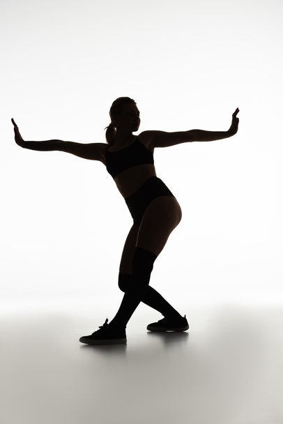 silhouette of sexy girl twerking isolated on white - Φωτογραφία, εικόνα