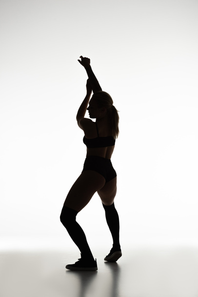 silhouette of sexy girl twerking isolated on white - Photo, Image
