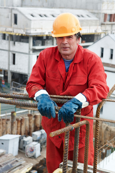 Worker builder at construction site - Фото, изображение