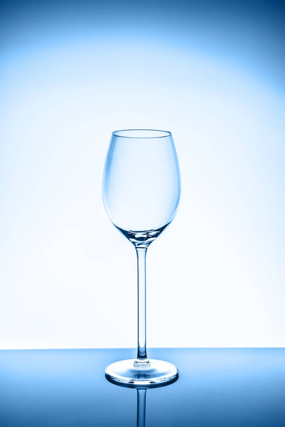 WIneglass on the light background toned in blue - Foto, Imagen