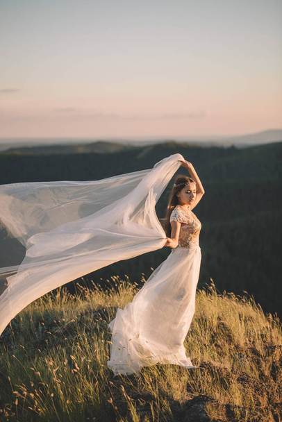 Beautiful bride outdoors in a forest. - Valokuva, kuva