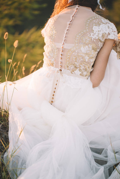 Beautiful bride outdoors in a forest. - Фото, зображення