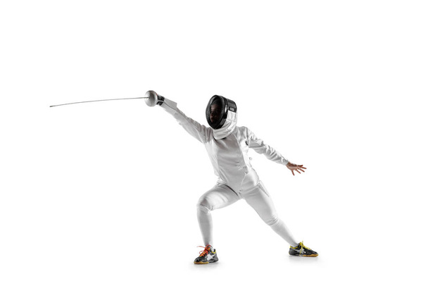 Teen girl in fencing costume with sword in hand isolated on white background - Foto, immagini