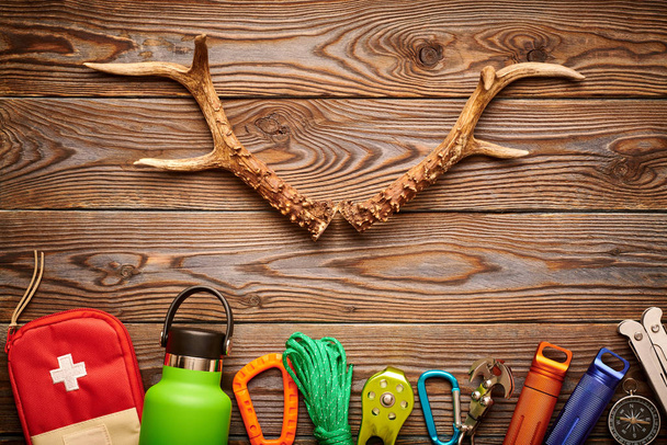 Travel items for hiking over wooden background - Photo, Image