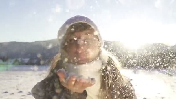 Woman blowing snow - Footage, Video