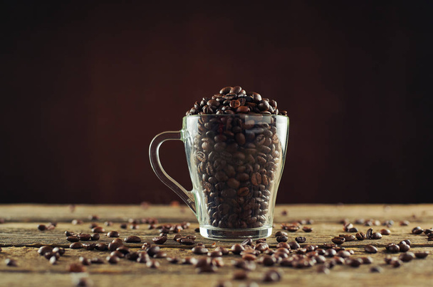 Roasted coffee beans in a glass glass - Photo, Image