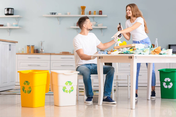 Couple sorting garbage at home. Concept of recycling - Photo, Image