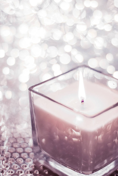Blush pink aromatic candle on Christmas and New Years glitter ba - Photo, Image
