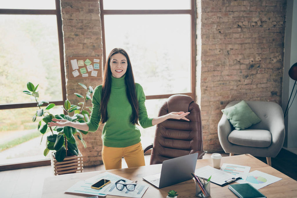 Photo of pretty business lady meet partners friendly smiling important company guests need take money investment wear green turtleneck yellow trousers modern interior office - Fotó, kép