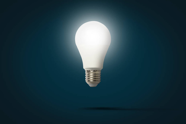 Lâmpada de luz LED voando no ar em um fundo azul escuro. O conceito de economia de energia, economia de energia. Levitação
 - Foto, Imagem
