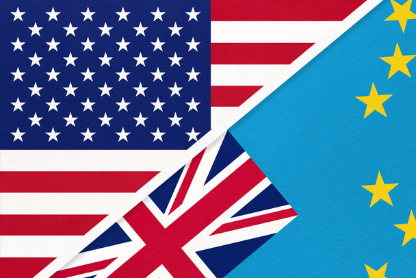 USA vs Tuvalu national flag from textile. Relationship between american and Oceania countries. - Photo, image
