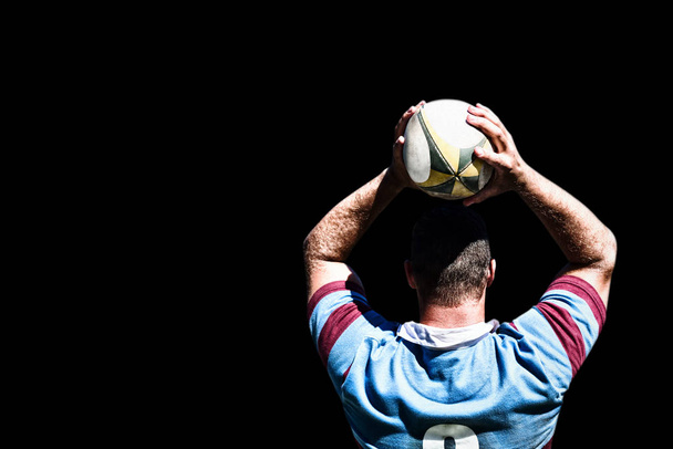 Rugby player against black background  - 写真・画像