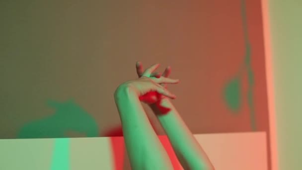 Closeup of the hands of a girl lying on the bed. - Imágenes, Vídeo