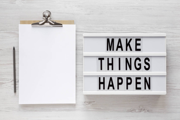 'Make things happen' words on a modern board, clipboard with bla - Фото, изображение