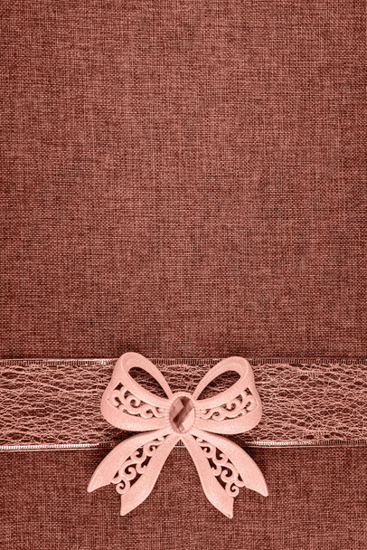 Vertical image with bow and ribbon toned in coral - Photo, Image