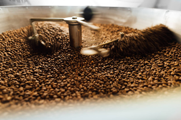 beans in a moving coffee cooling mixer - Zdjęcie, obraz