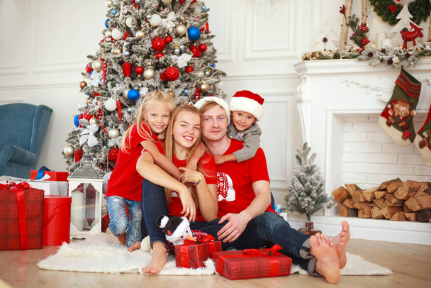 Portrait of happy family at home in traditional holiday  - Фото, изображение