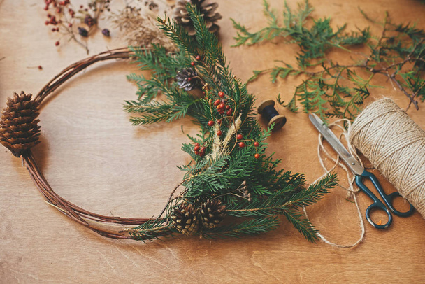 Rustic Christmas wreath. Creative christmas wreath with fir bran - 写真・画像