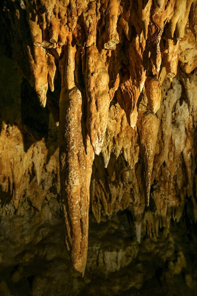 Luray Caverns,VA. Yellow backdrop. Stone texture. Usa travel. - Photo, Image