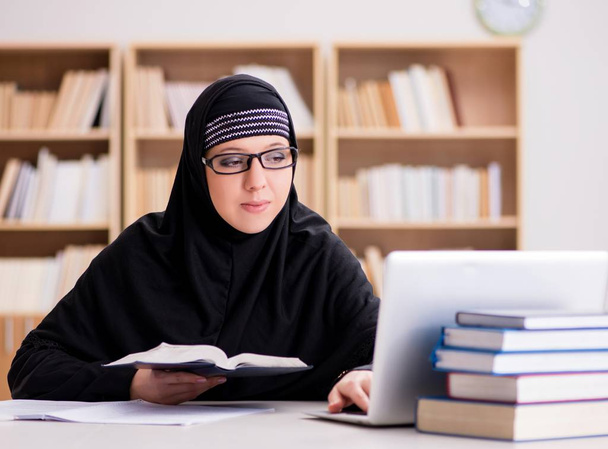 Muslim girl in hijab studying preparing for exams - Photo, Image