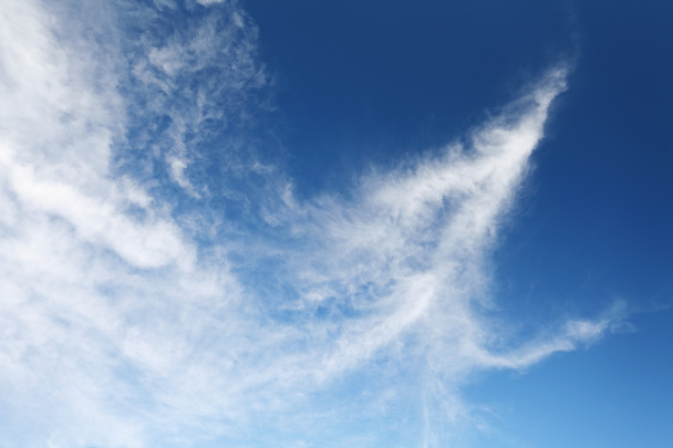 clouds in arrow shape on blue sky - Photo, Image