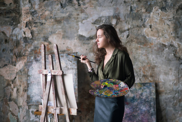 Artist woman painter with paintbrush and palette - Photo, Image