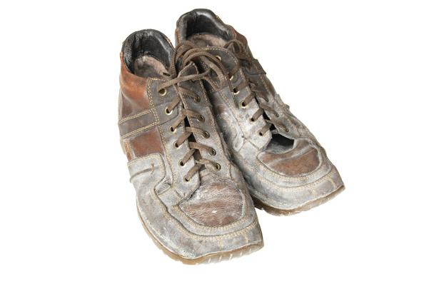 modderige laarzen in het stof van bouw - Foto, afbeelding
