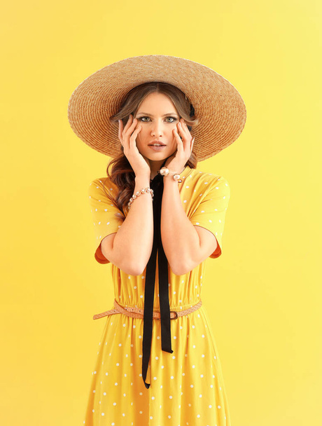 Fashionable young woman on color background - Photo, image