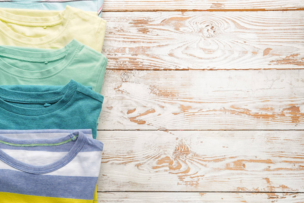 Clean baby clothes on table - Foto, Imagen