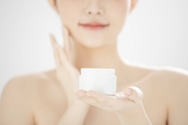 young woman holding moisturizer cream jar - Photo, Image