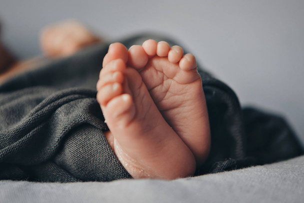 Newborn Baby's feet. legs massage concept of childhood, health care, IVF, hygiene - 写真・画像