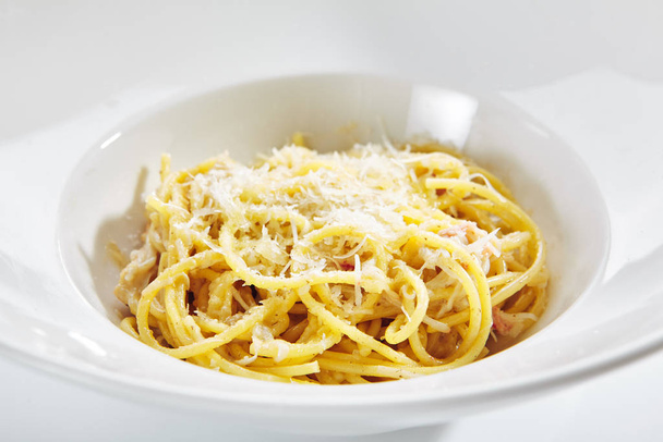 Italian Spaghetti Alla Carbonara with Grated Parmesan - 写真・画像