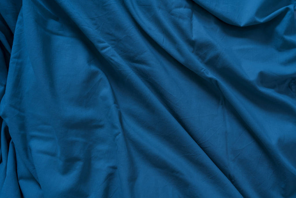 Color fabric drapery textile background of the blue classic color of the 2020 year.  - Photo, Image