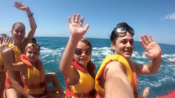 Happy people having fun in the sea on water attractions. - Footage, Video