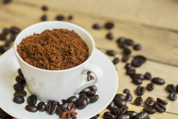 Closeup of a served cup filled with coffee powders - Photo, image