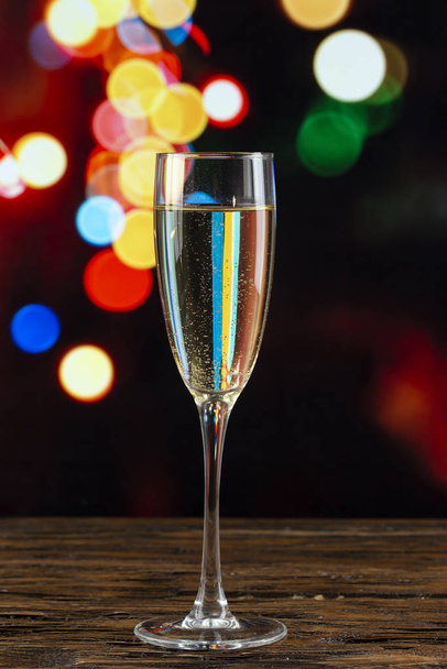 glass of champagne on bokeh background - Photo, Image