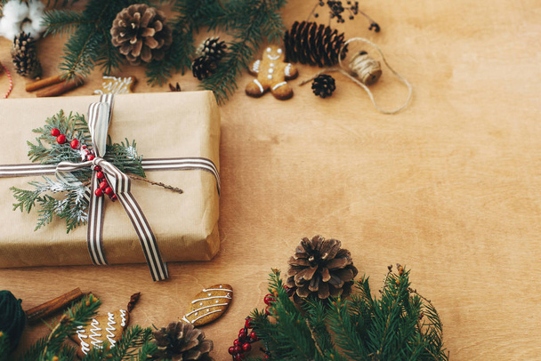 Merry Christmas. Stylish rustic christmas gift and  pine branche - Фото, изображение