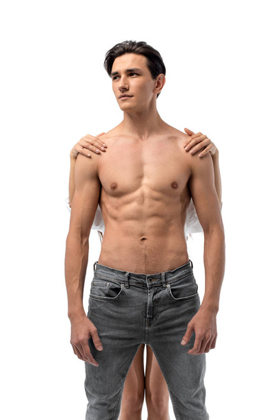 girl standing behind sexy shirtless man, isolated on white - Fotoğraf, Görsel