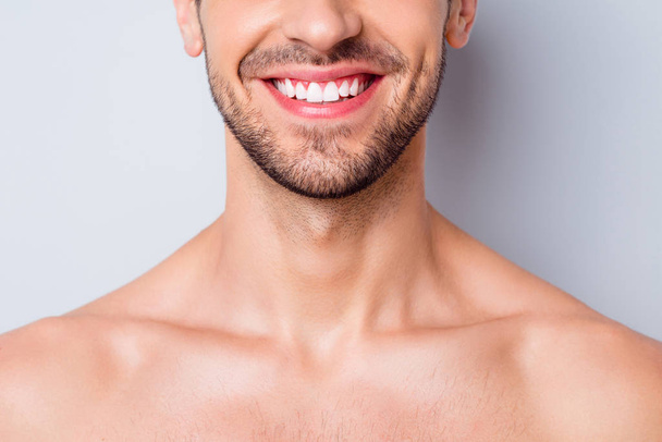 Close-up cropped view portrait of his he nice attractive bearded cheerful cheery guy unshaven mustache chin perfect smile caries treatment isolated on light white grey color pastel background - Foto, Imagen