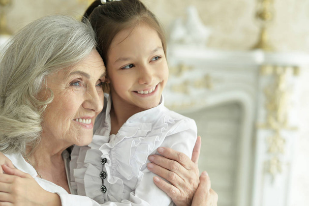 Grandmother  with her cute  granddaughter smiling  - Valokuva, kuva