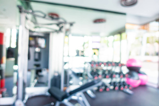 Abstract blur gym room interior with fitness equipment - Photo, Image