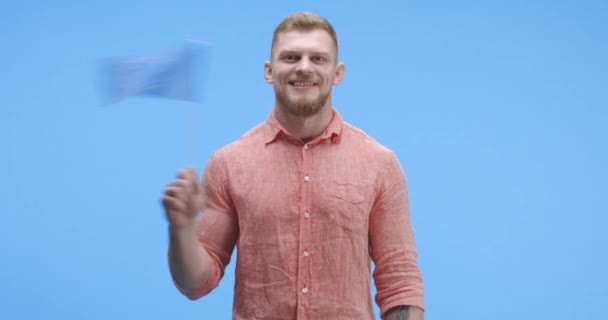 Young man waving European flag - 映像、動画