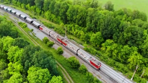 Aerial shot of freight train that travels by rail. Taken by drone at sunset - Footage, Video