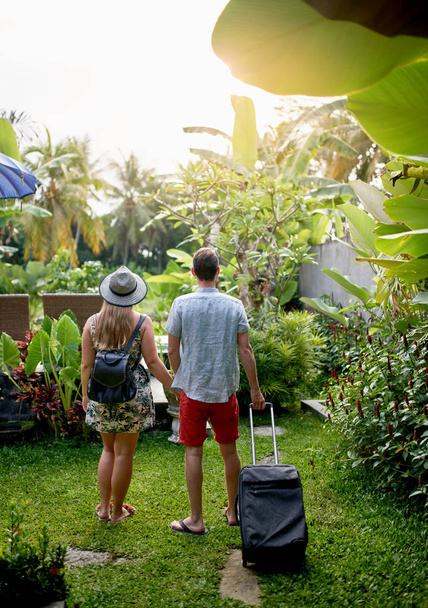 Millennial hipster couple looking at exotic tropical plants toge - Photo, Image
