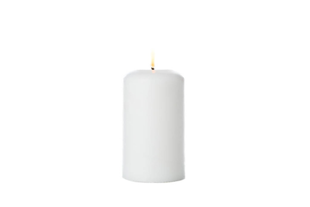 Glowing white candle isolated on white background - 写真・画像
