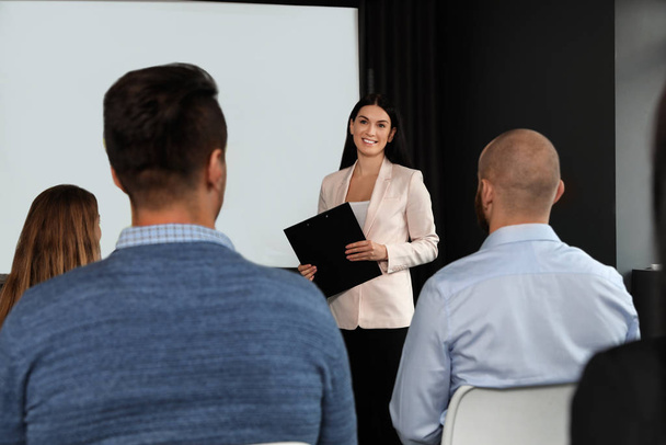 Business people at seminar in conference room with video projection screen - Fotoğraf, Görsel