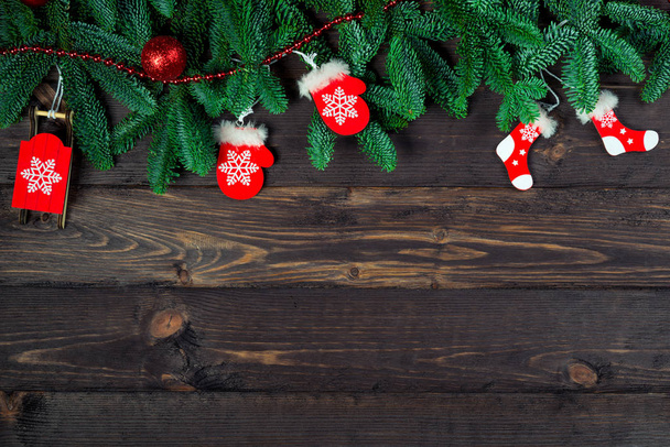 Dark background wooden boards and objects Christmas toys with a  - Fotografie, Obrázek