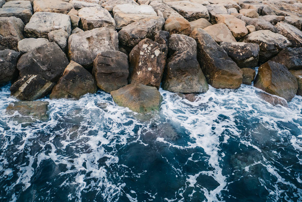 Sea waves and rocky coast in Cyprus. Beautiful nature mediterranean background - Fotó, kép