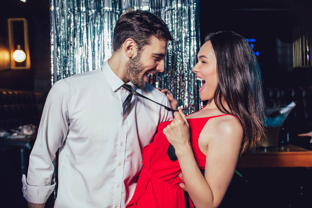 Couple dancing in the night club. Young man and woman having fun - Fotó, kép